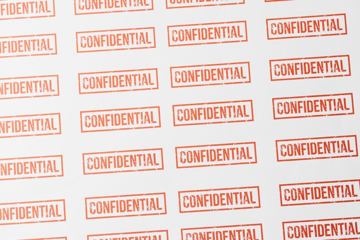 Repeating red 'CONFIDENTIAL' stamps across a white background, forming a grid pattern