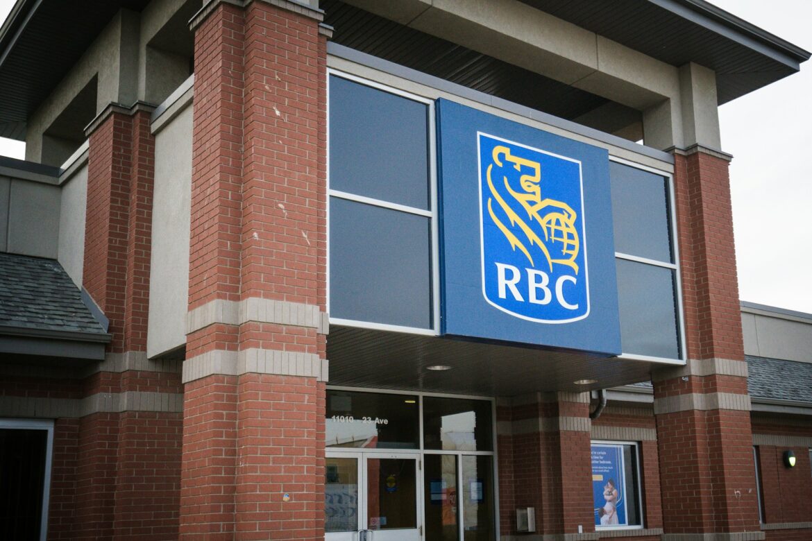 Exterior of a brick building with an RBC bank sign featuring a yellow lion on blue background.