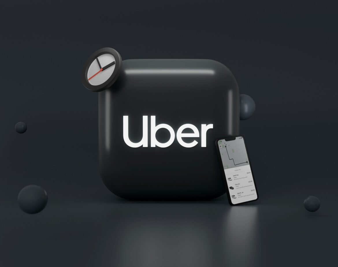 Uber app branding on a dark rounded device with a small clock and a tilted phone displaying a map